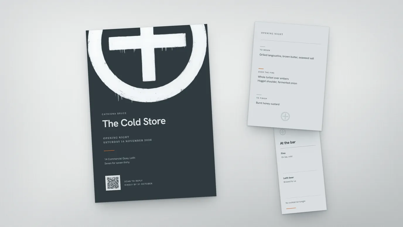 A restaurant opening-night invitation in near-black with a large painted monogram, carrying a QR code beside the words scan to reply, with a menu card and a bar card alongside.